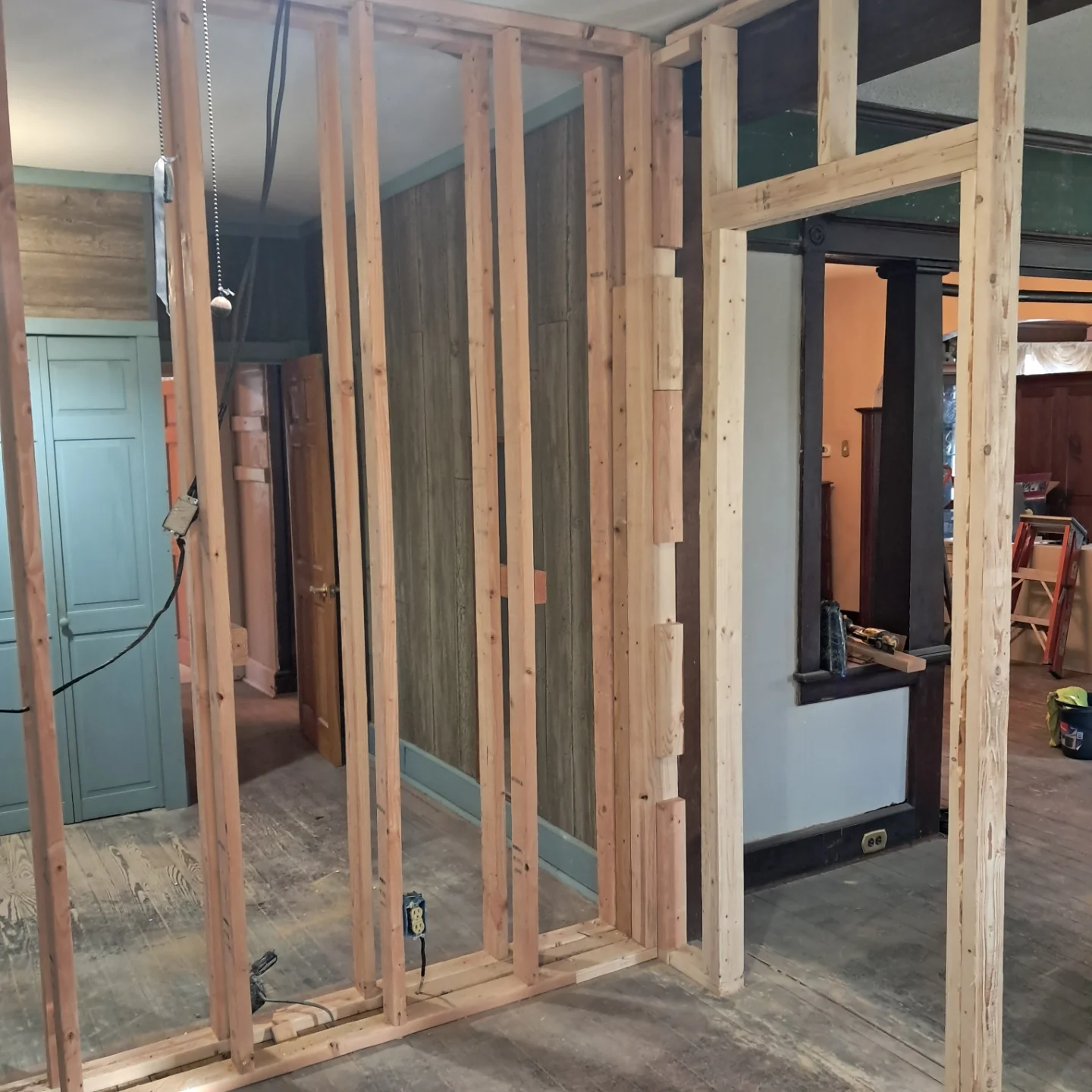 New interior stud wall framed inside an older home